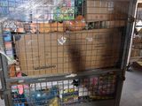 a large metal cart with boxes on it in a warehouse
