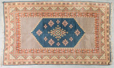 a blue and orange rug with a diamond design on it