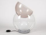 a clear glass vase with a light inside of it