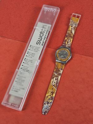 a watch that is sitting next to a watch in a box