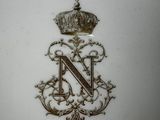a close up of a plate with a crown on it