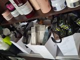many bottles and containers of cosmetics on a shelf