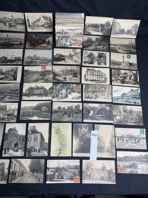 a lot of old black and white pictures on the table