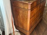 a wooden dresser with a tv on top of it