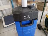 an image of a blue and black water cooler in a garage