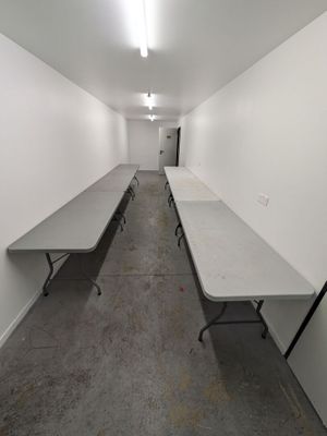 a long table in the middle of a long room