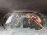 a close up of a car dashboard with a speedometer