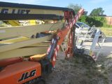 a crane that is sitting on the ground next to a truck