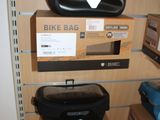 many boxes on the shelves of a bike bag store