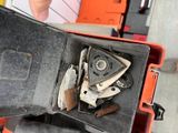 someone is holding a tool box with a bunch of tools inside of it