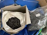a box with a bunch of pins in it on a table