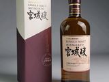a bottle of single mal japanese whisky next to a box
