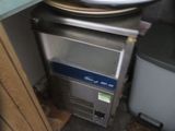 a plate of food sitting on a counter next to a toaster oven