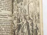 an open book with a picture of a man and a woman in a medieval setting
