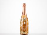 a bottle of champagne sitting on top of a white table