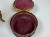 a small box with a lid sitting on a table