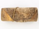 a piece of wood that has been wrapped in a leather case