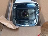 a box with a camera inside of it on the floor