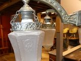 two lamps that are hanging from the ceiling in the room
