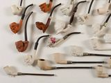 many different types of pipe smokings on a white surface