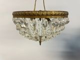 a chandelier hanging from the ceiling in a room
