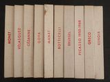 six livres portant des inscriptions rouges, posés sur une surface noire