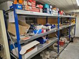 many shelves with boxes on them in a room