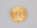 a gold coin with a picture of a woman on it