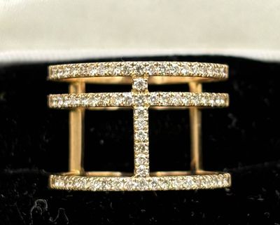 an image of a gold ring with diamonds on it