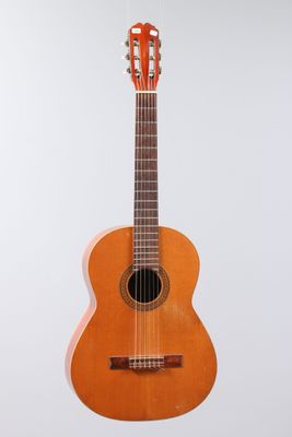 a close up of an acoustic guitar on a white background