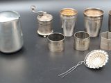 a lot of silver items on a black table
