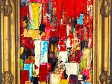 un tableau représentant un paysage urbain rouge et jaune, dans un cadre doré