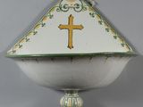 a white bowl with a yellow cross on it