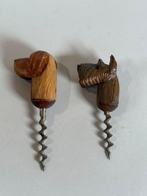 two wine openers with a horse head on them
