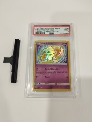 a close up of a pokemon card in a plastic case