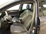 the interior of a car with the door open and the driver ' s seat down