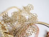 a close up of a bunch of jewelry on a table