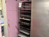 an image of a commercial kitchen with a stainless steel refrigerator