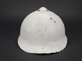 a close up of a white helmet on a black background
