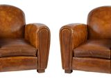 pair of leather club chairs with arms and legs