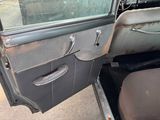 an old car door with a broken handle on it