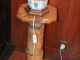 a vase that is sitting on a table with a cord