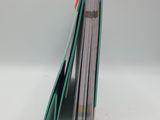 a stack of books sitting on top of a white table