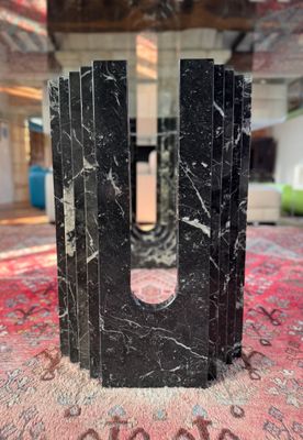 black marble bookends on a red carpet in a living room