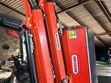 a red machine that is sitting inside of a building