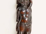 a wooden carving on the wall of a room
