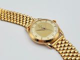 an image of a close up of a wrist watch on a white surface