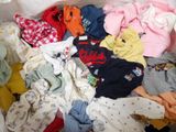 a pile of clothes that is in a white box