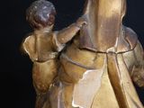 a statue of a woman holding a baby in her arms