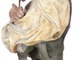 a statue of a man with a pipe in his hand
